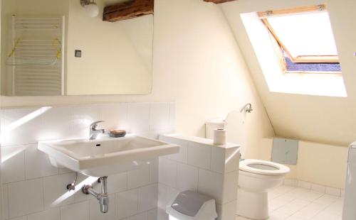 a bathroom with a sink and a toilet at Guesthouse Lessi in Zagreb