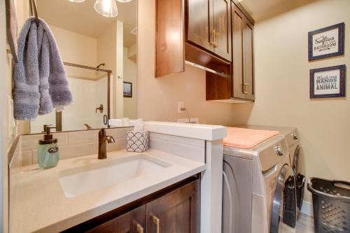 a bathroom with a sink and a washing machine at Lovely McCall Retreat Less Than 2 Mi to Payette Lake! in McCall