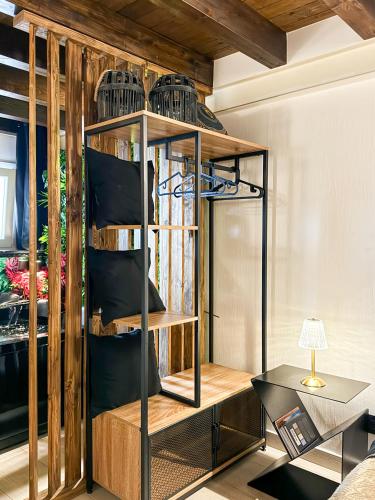 a room with a shelf with bird cages on it at Rouge Suite & SPA PALERMO CENTRO in Palermo