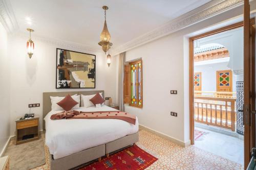 Postel nebo postele na pokoji v ubytování Riad Atlas Palace & SPA