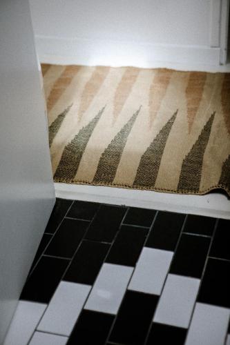 a room with a rug on the floor in a room at VILLA Centre Guethary piscine acces ocean a pied in Guéthary