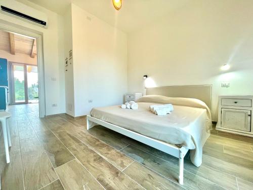Katil atau katil-katil dalam bilik di Le Corti Sarde Beach Apartments