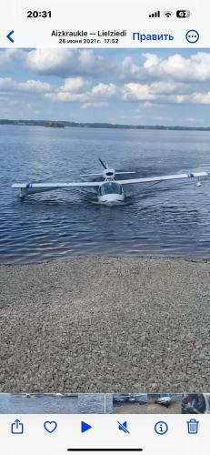 a seaplane sitting on the water in the water at Daugava in Aizkraukle