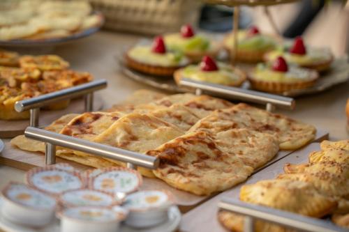 a display of pies and pastries on a table at Riad Atlas Palace & SPA in Marrakech