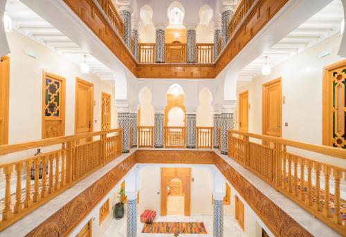 a large hall with a pool in a building at Riad Atlas Palace & SPA in Marrakech