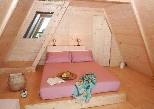Postel nebo postele na pokoji v ubytování Glamping Fonte Murata