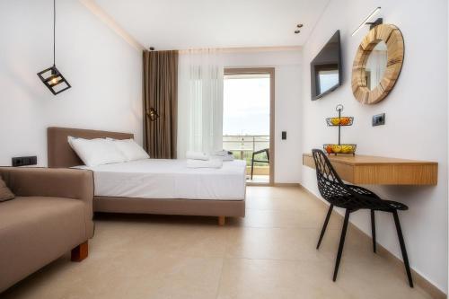 a bedroom with a bed and a desk and a chair at Calma Living in Potos
