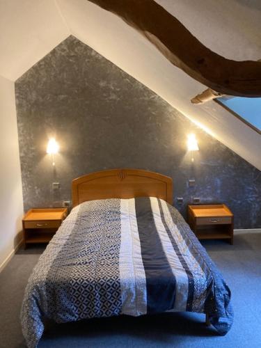 a bedroom with a bed and two night stands at gite de montagne in Barèges