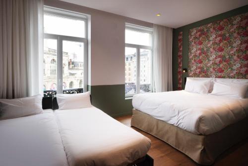 Postel nebo postele na pokoji v ubytování Rosa Hotel
