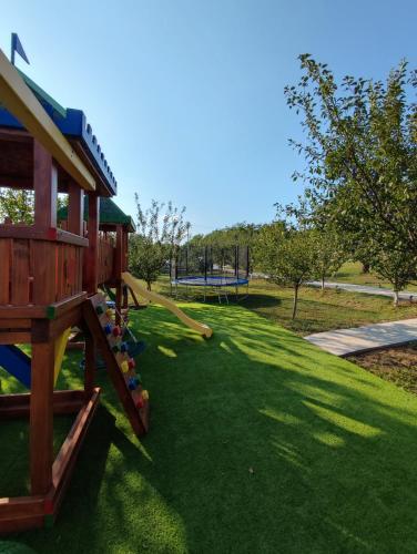 a playground with a slide in a park at Panorama Kosmaj in Drumine
