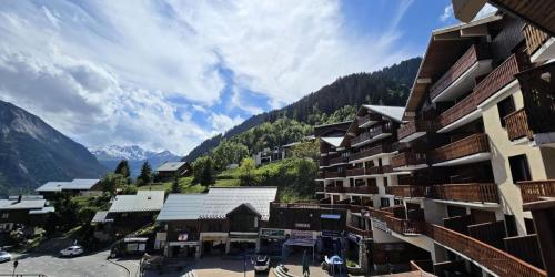 arial view of a town in the mountains with buildings at Résidence Le Centre - Studio pour 4 Personnes MAE-3346 in Champagny-en-Vanoise