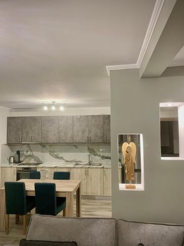 a living room with a table and a kitchen at Coastal vista retreat 2 in Neos Panteleimonas