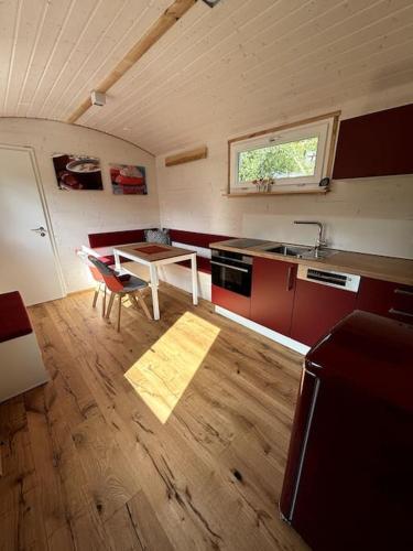 a kitchen with a sink and a table in a room at Tiny House - Zwetschge in Wald