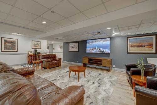 a living room with a couch and a flat screen tv at Riverside Hotel in Casper