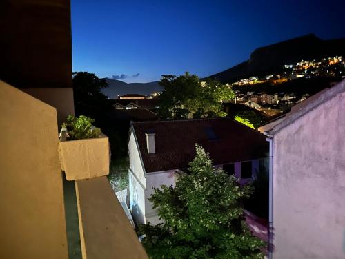 a view of a city at night from a building at Villa Anja Apartments in Mostar