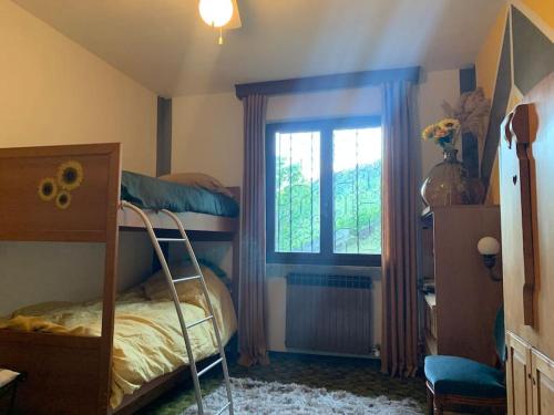 Ένα ή περισσότερα κρεβάτια σε δωμάτιο στο La maison de P I M P I N