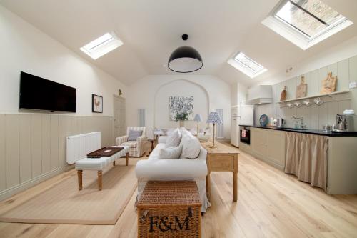 a living room with a couch and a table at The Motor House in Newcastle upon Tyne