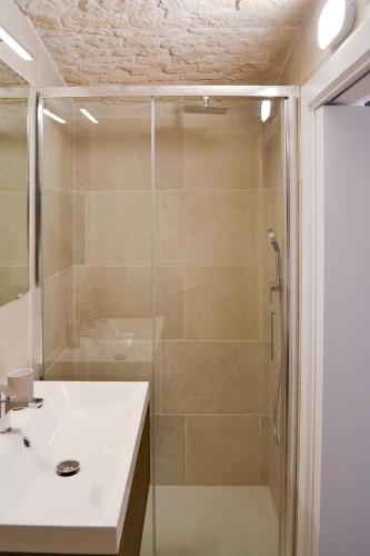 a bathroom with a shower and a sink at Dimora Manzoni in Noci