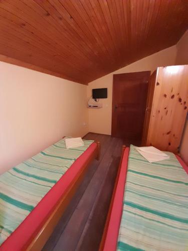 Postel nebo postele na pokoji v ubytování Guest House Lorian