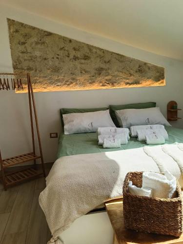 a bedroom with a bed with towels on it at Di Finizio_Cottage in Barrea
