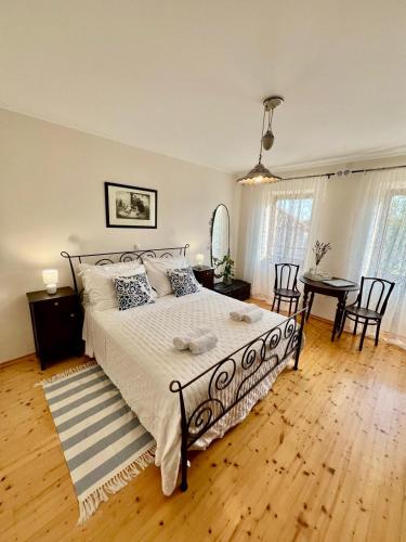 a bedroom with a bed and a table and chairs at Ciborovi Dvori in Bribir