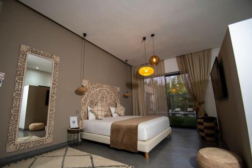 Ένα ή περισσότερα κρεβάτια σε δωμάτιο στο Villa Le Clos de l'Atlas