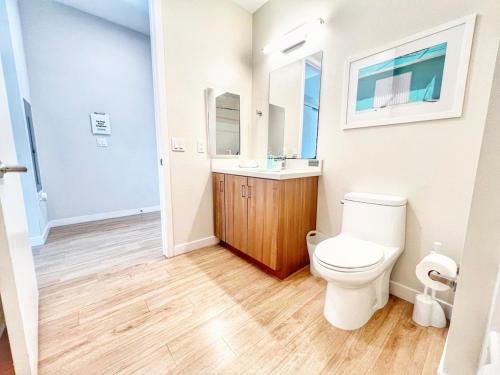 a bathroom with a toilet and a sink at The Traveler's Getaway in San Diego
