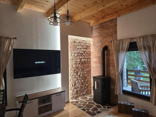 Телевизор и/или развлекательный центр в Cottage Catherine