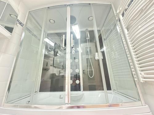 a shower with a glass enclosure in a room at Sol y Mar Fuengirola in Fuengirola