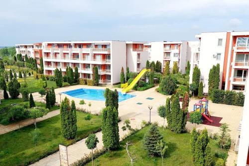 an apartment building with a pool and a playground at Nessebar Fort Club apartment 363 in Sunny Beach