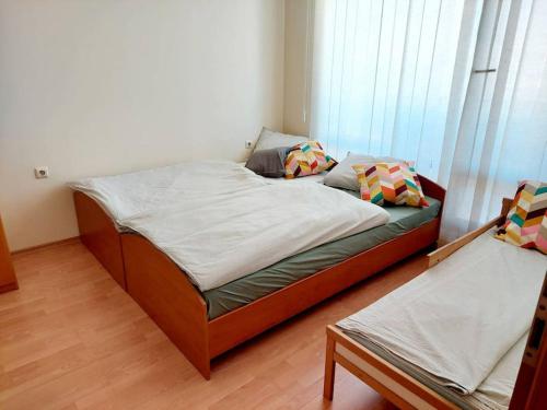 a bedroom with a large bed with two pillows at Nessebar Fort Club apartment 363 in Sunny Beach