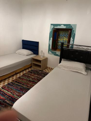 Ένα ή περισσότερα κρεβάτια σε δωμάτιο στο The blue house