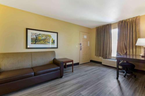 a living room with a couch and a desk in a room at Extended Stay America Suites - Phoenix - Chandler - E Chandler Blvd in Phoenix