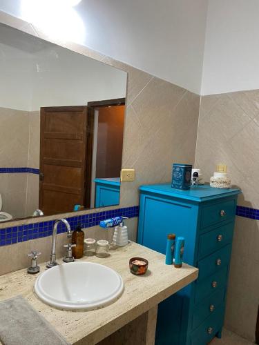 a bathroom with a sink and a mirror at CÉNTRICO in Santiago del Estero