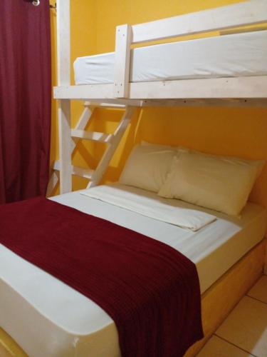 Кровать или кровати в номере Cabañas Martina Surf Playa Guanico