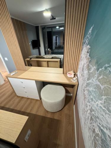 a room with a desk with a wave on the wall at Seaview Smart Home 2 in Varna City