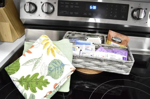two baskets sitting on top of an oven at Cozy escape! 2 BR Guest Suite! 2 Queen Beds! Complimentary WIFI Netflix & Parking! 11 Mins from YEG! 20 Mins from WEM! in Edmonton