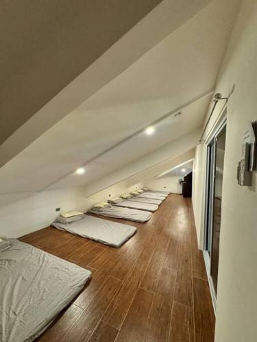 a row of mattresses are lined up in a room at GAVs Abode in Dumaguete