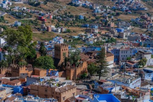 an aerial view of a city with blue buildings at Casa panorama in Chefchaouene