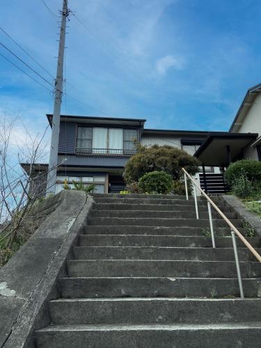 a set of stairs in front of a house at ソフィアハウス横浜 -女性専用シェアハウス- Sopfia House Yokohama for Women only shared house in Yokohama