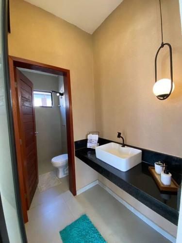 a bathroom with a sink and a toilet at LD House- Bananeiras in Bananeiras