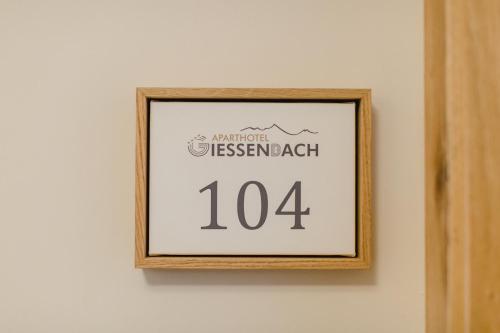 a picture of a sign on a wall at Hotel Giessenbach in Fügen