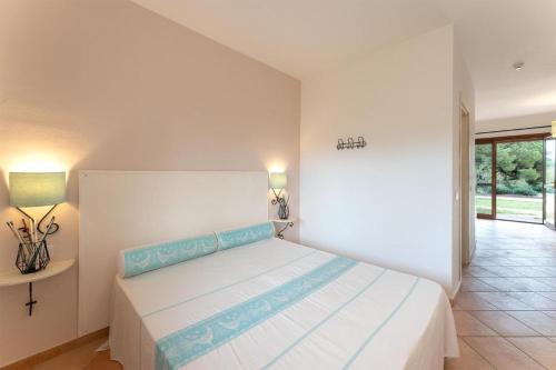a bedroom with a large bed in a room at Relaxing Residence Baia dei Mirti B4 1 Bedroom Apartment Sleeps 4 -Bilo 4 in Vignola Mare