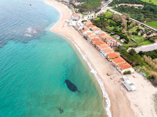 an aerial view of a beach with a resort at Relaxing Residence Baia dei Mirti B4 1 Bedroom Apartment Sleeps 4 -Bilo 4 in Vignola Mare