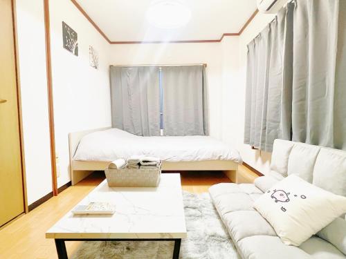 Postel nebo postele na pokoji v ubytování 西武新宿線 駅近最大4人d2