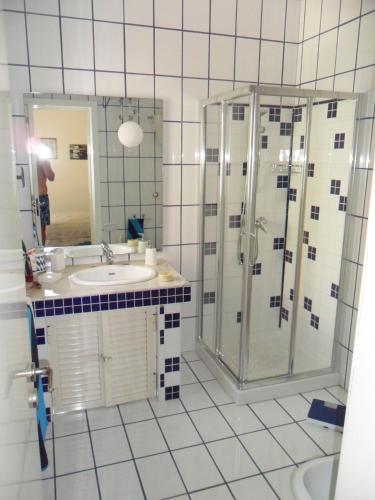 a bathroom with a shower and a sink at villa marisa by salentolimit in Torre Lapillo