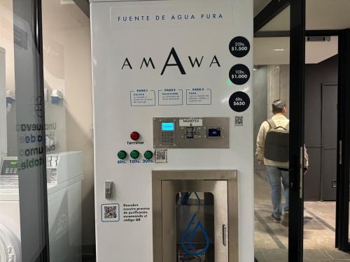 a sign for an amana piya in a building at HOM I Lujoso Depto 2D2B, Ñuñoa con Estacionamiento in Santiago