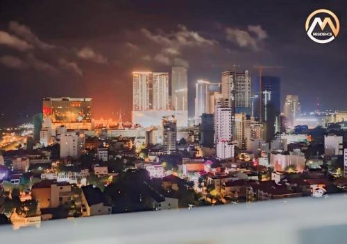 a view of a city at night at Hotel Serviced Condo Unique Infinity Pool with Mekong River View in Phnom Penh