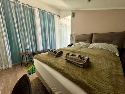 Posteľ alebo postele v izbe v ubytovaní Borbara Apartman