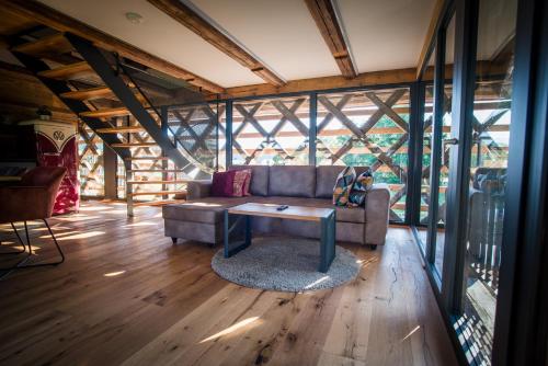 a living room with a couch and a table at Hayrack Skok Mozirje in Mozirje